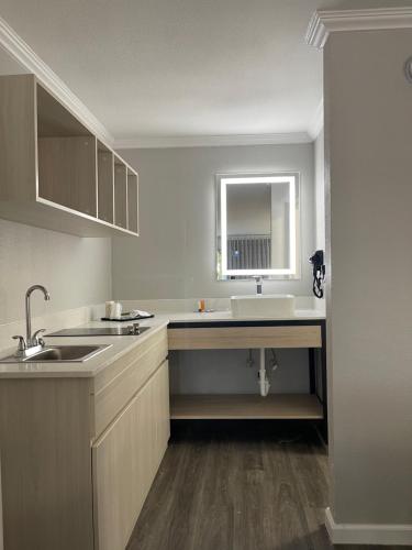 an empty kitchen with a sink and a sink at MainStay Suites Florence - Darlington in Florence
