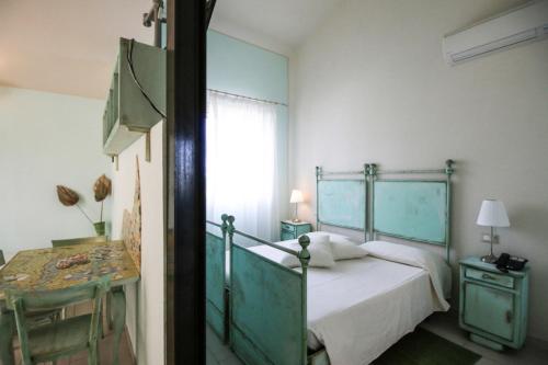 A bed or beds in a room at Lucciole Nella Nebbia