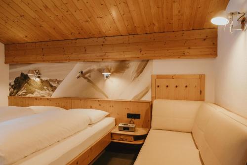 a bedroom with two beds in a room at Gästehaus Kolp in Sankt Anton am Arlberg