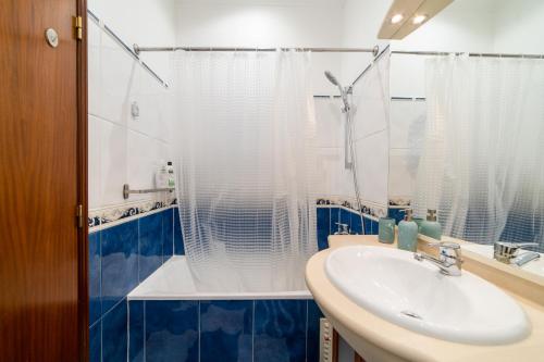 a bathroom with a sink and a shower at Your New Home in Lisbon - AC and Fast Wi-Fi in Lisbon