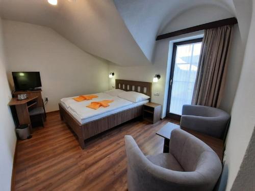 Postel nebo postele na pokoji v ubytování Hotel Flora