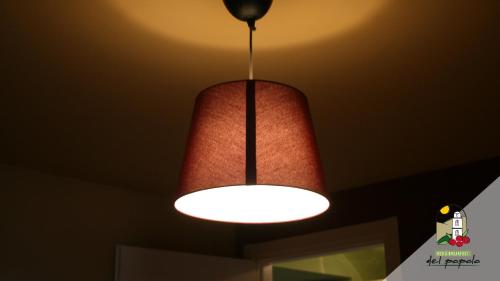 a red light hanging from a ceiling at Bed & breakfast del Popolo in Savoia di Lucania
