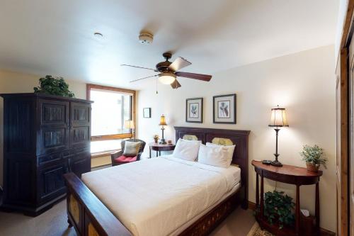 a bedroom with a bed and a ceiling fan at Vail Spa 301 in Vail