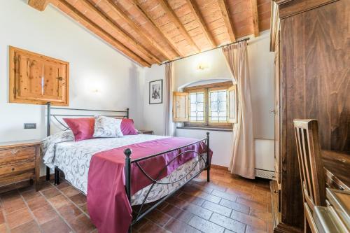 a bedroom with a bed and a wooden ceiling at Residenza Il Villino B&B in Florence