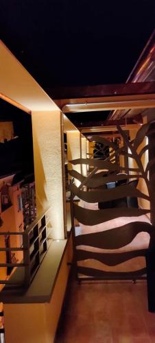 a room with a spiral staircase in a building at Hotel Roma in Bologna