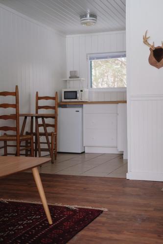a kitchen with a table and chairs in a room at Anchor Inn in Traverse City