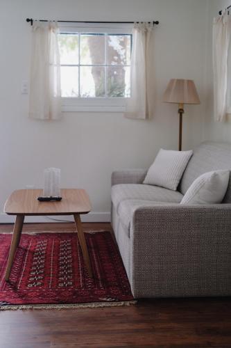 a living room with a couch and a table at Anchor Inn in Traverse City