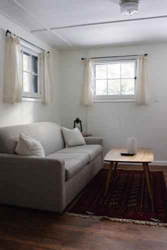 a living room with a couch and a table at Anchor Inn in Traverse City