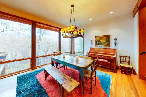 a dining room with a table and a piano at Aspen Meadows Resort 111 in Aspen