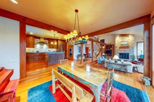 a kitchen and living room with a table and a couch at Aspen Meadows Resort 111 in Aspen