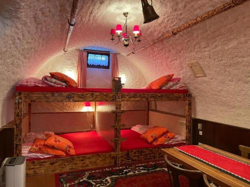 a bedroom with two bunk beds in a room at Casa Job - Gasthaus - Sauna, Whirlpool - Trun in Trun