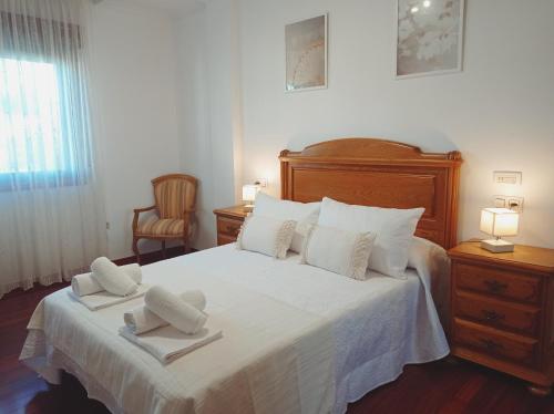 Ένα ή περισσότερα κρεβάτια σε δωμάτιο στο Martínez Rooms Pilgrims