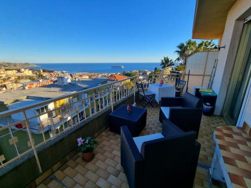 a balcony with chairs and a view of the ocean at Il Paradiso del Relax Chambres d'hotes Affittacamere room with sea view in Sanremo