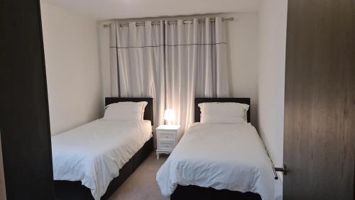 Posteľ alebo postele v izbe v ubytovaní Cushy Apartments, Colindale