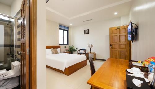 Postel nebo postele na pokoji v ubytování LARA HOTEL LONG XUYÊN