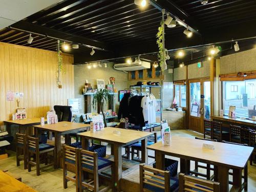 a kitchen area with a table and chairs at 4S STAY Awaikeda Ekimae in Miyoshi