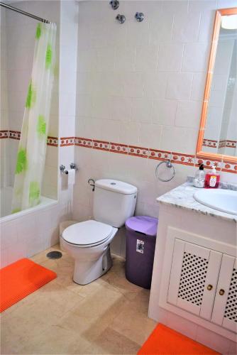 a bathroom with a toilet and a sink at FABULOUS 2 BED 2 BATH APARTMENT ! in Villamartin