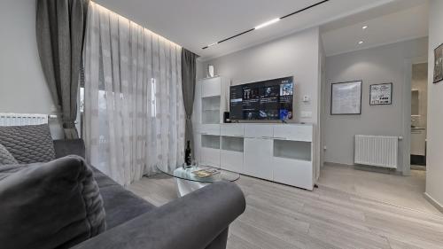 a living room with a couch and a table at Apartman Nostra in Zagreb