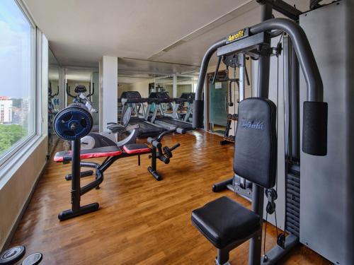 a gym with several treadmills and exercise bikes at Sayaji Vadodara in Vadodara