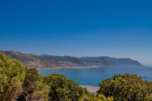 a view of a body of water with boats in it at A Boat House in Simonʼs Town
