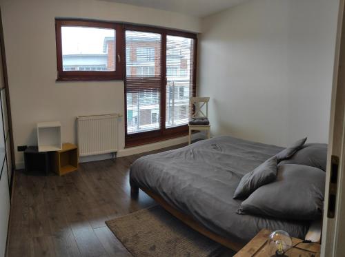 Posteľ alebo postele v izbe v ubytovaní Apartament Górski
