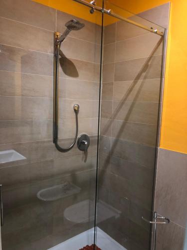 a shower with a glass door in a bathroom at Il Castello - Appartamento in zona residenziale in Modena