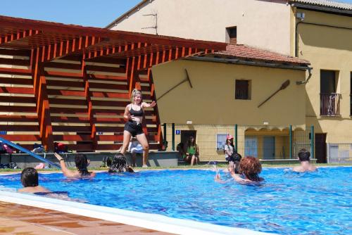 a group of people in a swimming pool at Camping Gran Sol in Montferrer