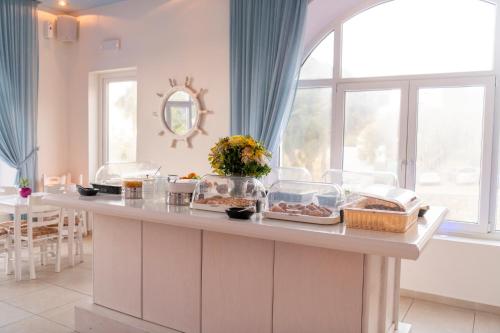 a kitchen with a counter with food on it at Makis Place in Tourlos