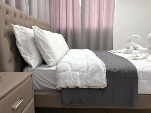 Ένα ή περισσότερα κρεβάτια σε δωμάτιο στο Hotel Room Service