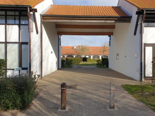 an empty parking lot in a building with a garage at Duinengolf 5 in Middelkerke
