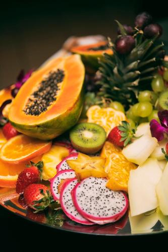 a plate of fruits and vegetables on a table at Hotel Kotarz Spa&Wellness in Brenna