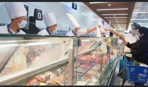 a group of chefs preparing food in a store at Staycation in Manila