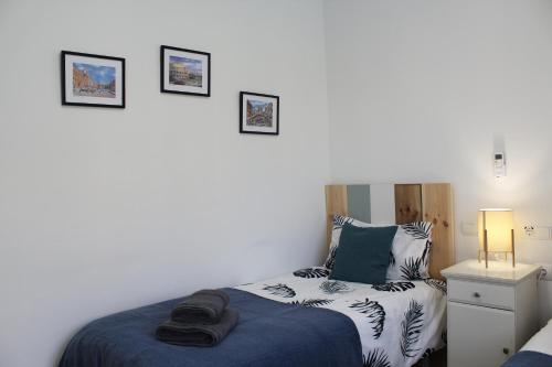 a bedroom with a bed and a night stand with a bed sidx sidx at BEACH FOREST PARADISE in Cabopino