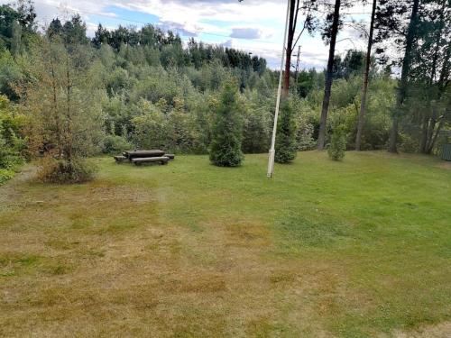 a park with a picnic table in the middle of a field at Двухкомнатные просторные апартаменты. in Imatra