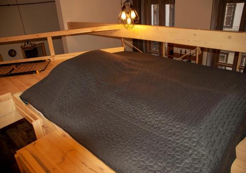 Posteľ alebo postele v izbe v ubytovaní Western apartman