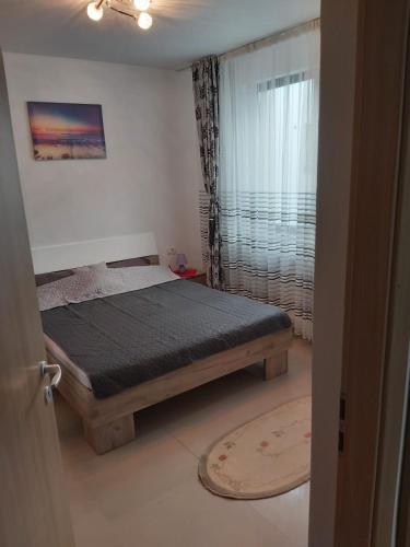 Llit o llits en una habitació de KAZEBOO APARTAMENT