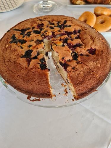 a cake sitting on a plate on a table at Hotel Perla Del Mare in Lido di Camaiore