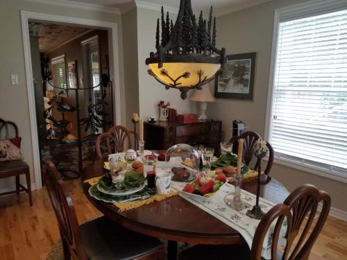 a dining room with a table with food on it at Four Ninety Muskoka B & B in Gravenhurst