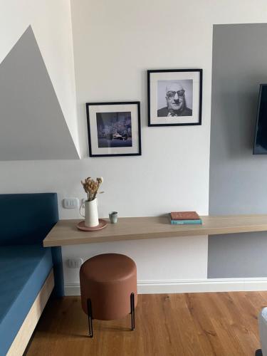 a desk in a room with a chair and a table at Ca’ Prandini in Maranello