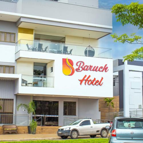 a building with a sign for a banquet hotel at Baruch Hotel in Araguaína