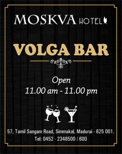 a sign for a vosa bar with two people dancing at Moskva Hotel in Madurai