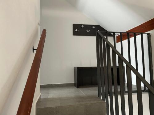a staircase in a house with a sign on the wall at Apartmán D5 Nová Pec in Nová Pec