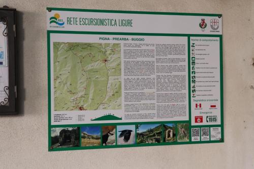 a sign on a wall hanging on a wall at Appartamento Ca' Baci' in Pigna