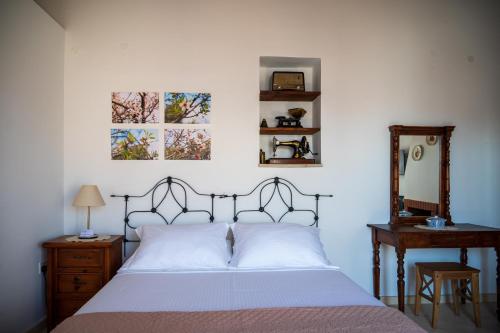 a bedroom with a bed and two pictures on the wall at Rothkia's Home in Parekklisha