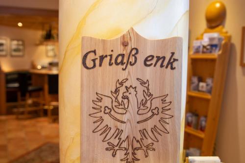 a sign that says grips exit on a wall at Hotel Garni Alpenhof in Ischgl