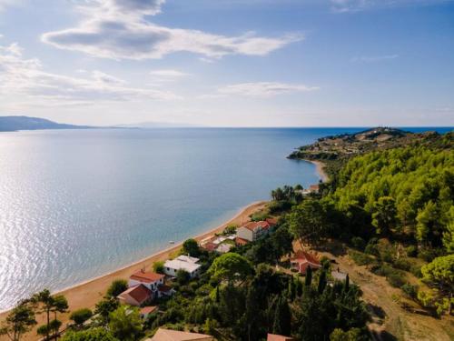 an aerial view of a beach next to the water at Diwani Luxury Villas in Lixouri
