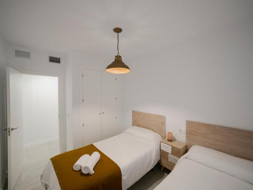 A bed or beds in a room at Haus Modern Duque fjHomefj
