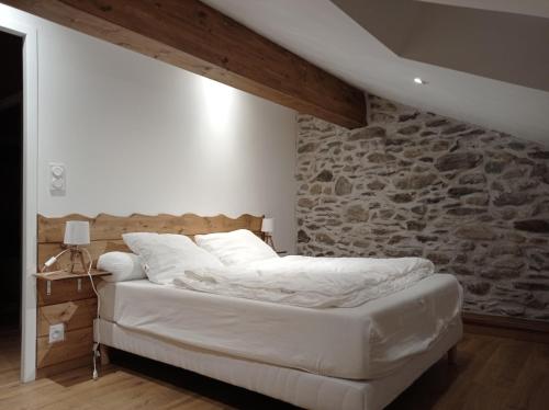 מיטה או מיטות בחדר ב-Le Montagnon