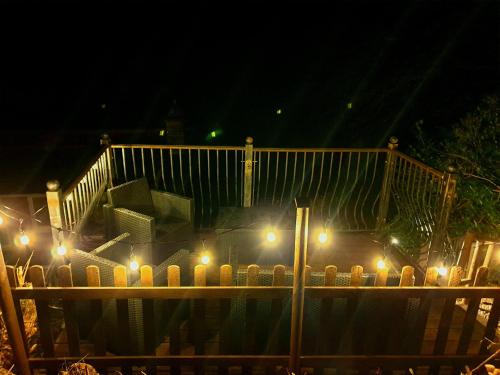 a group of candles on a table at night at The Eaves in Lynton, Exmoor, Devon in Lynton