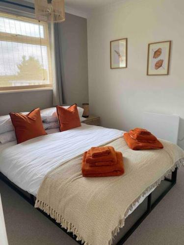 two towels sitting on a bed in a bedroom at Ruby’s Retreat in Belton